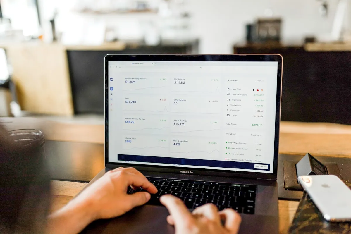 Small business owner reviewing their new website on a laptop